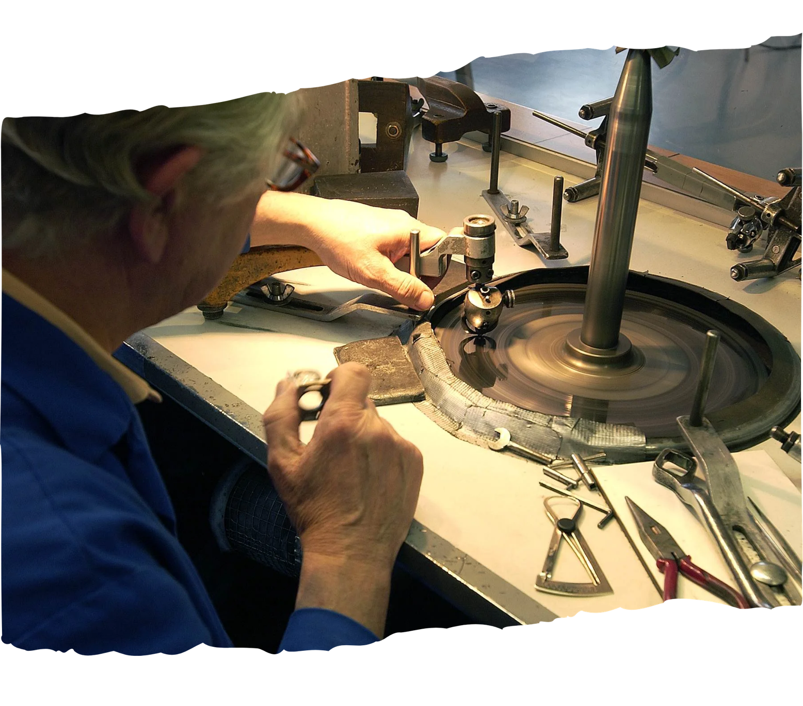A close-up view of specialized diamond-tipped tools expertly faceting the raw cremation diamond, shaping it into a brilliant cut to maximize light return, fire, and ultimate sparkle.