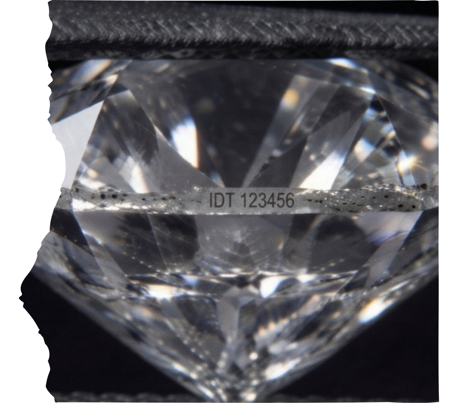 Microscopic view of a laser inscription on the girdle of a memorial diamond during Stage 6 authentication.