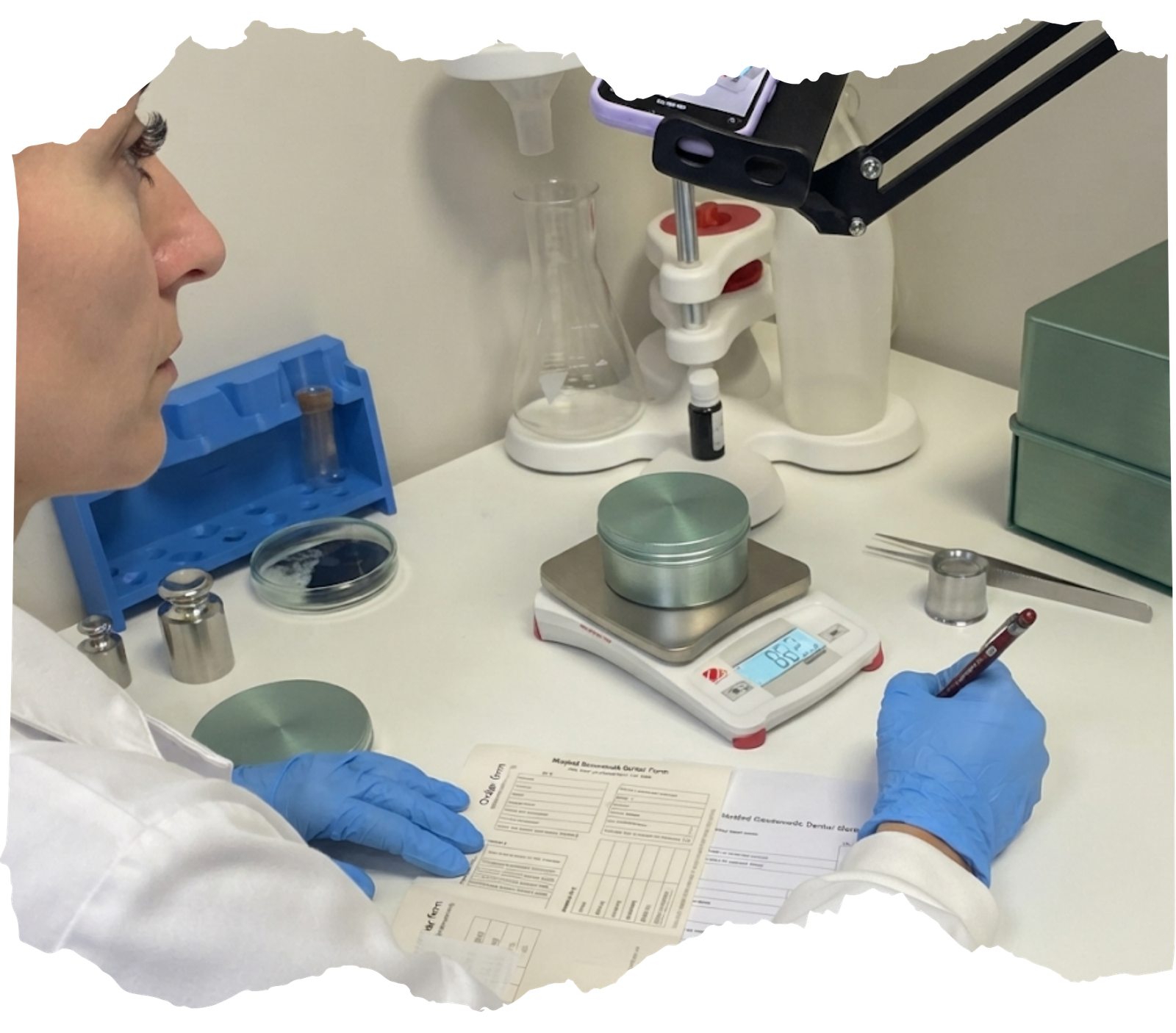 Stage 1 carbon isolation for memorial diamonds showing a scientist weighing ashes in a laboratory.